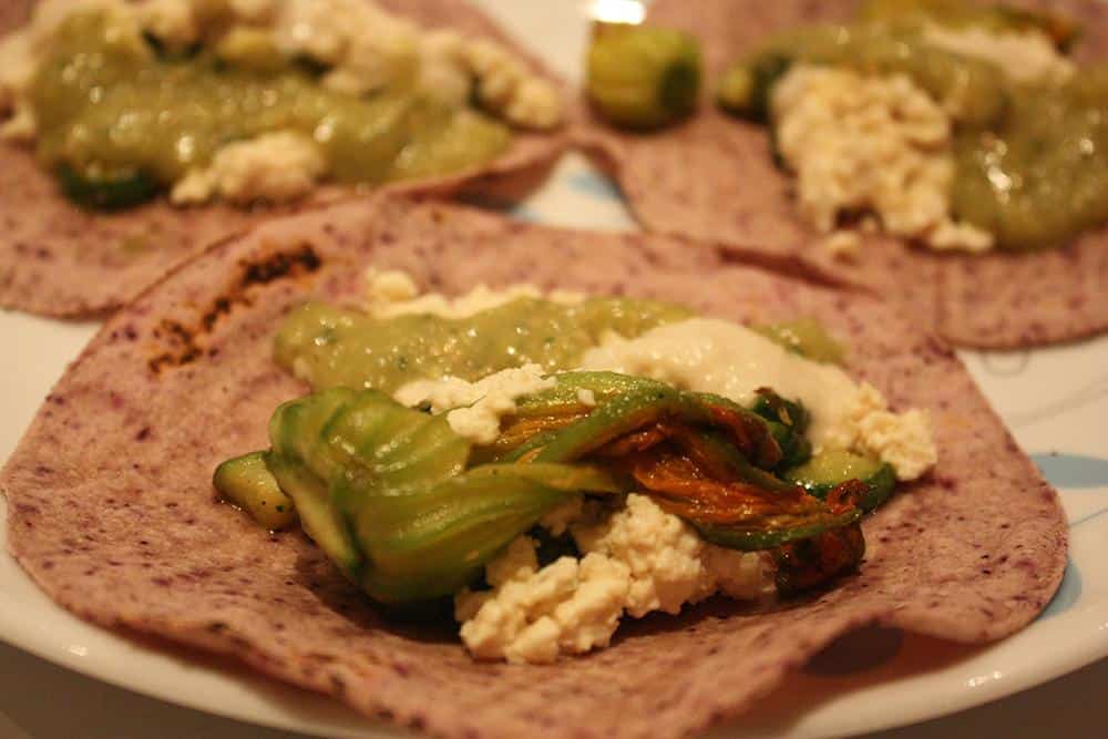 Courgette flower (zucchini blossom) tacos with tofu cotija cheeseand roasted tomatillo salsa