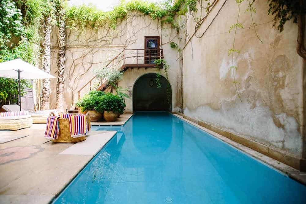 Stone wall surrounds a pool