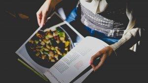 Person reading a cookbook