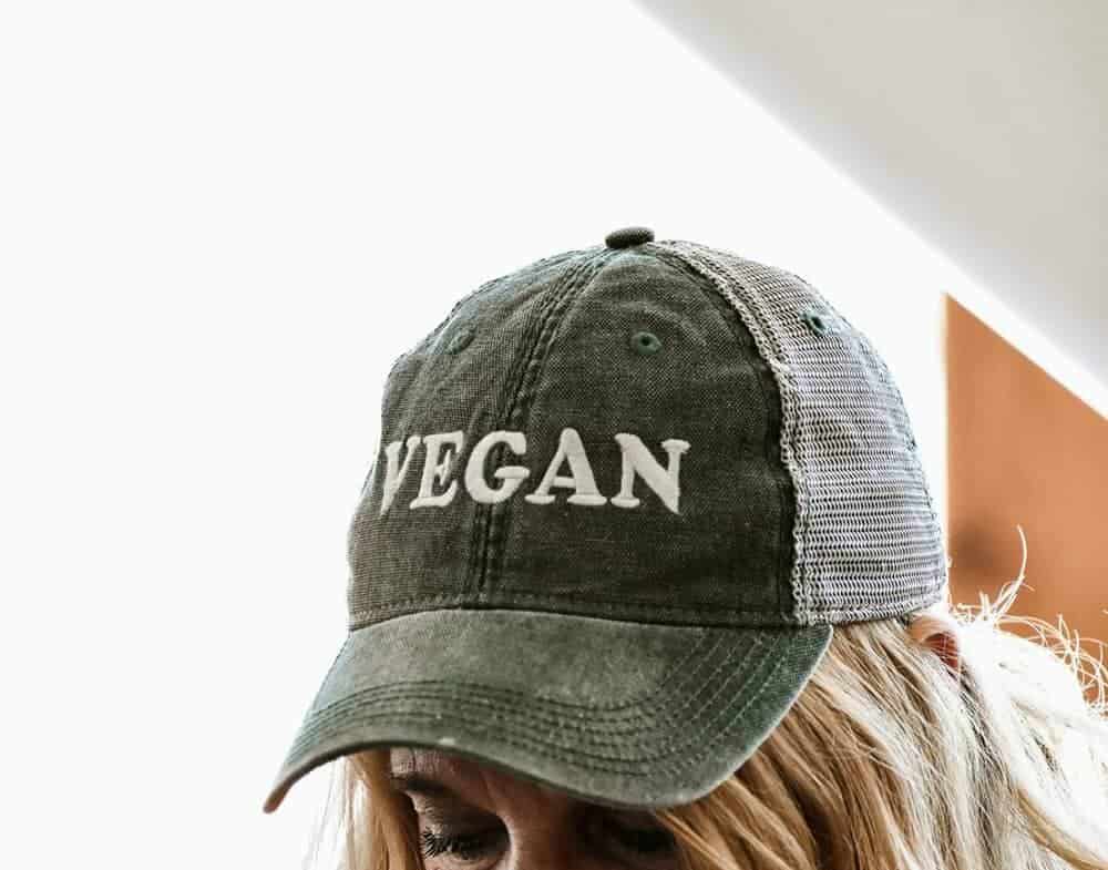 Woman wearing hat that says vegan