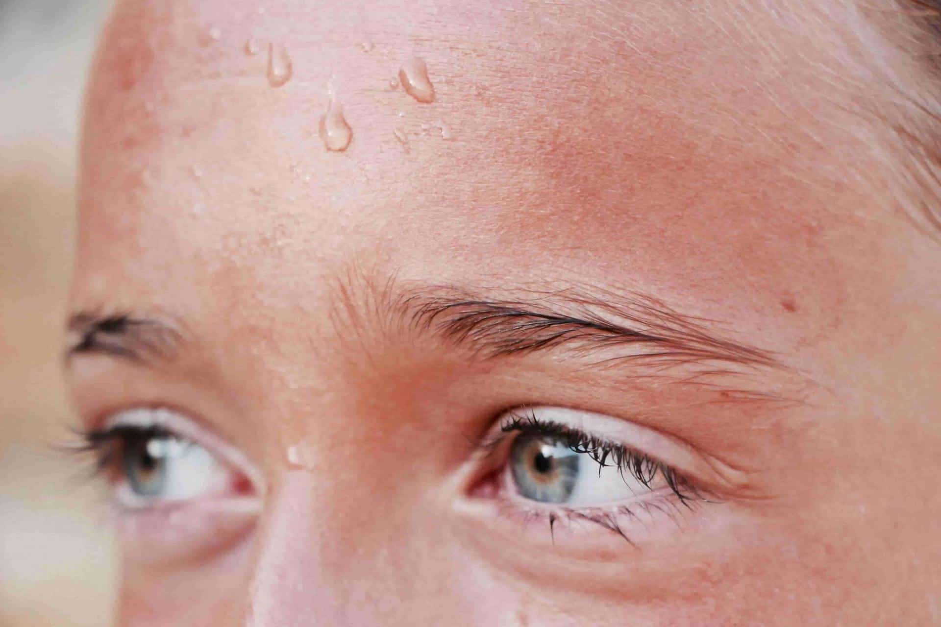 Beads of sweat on a person's face