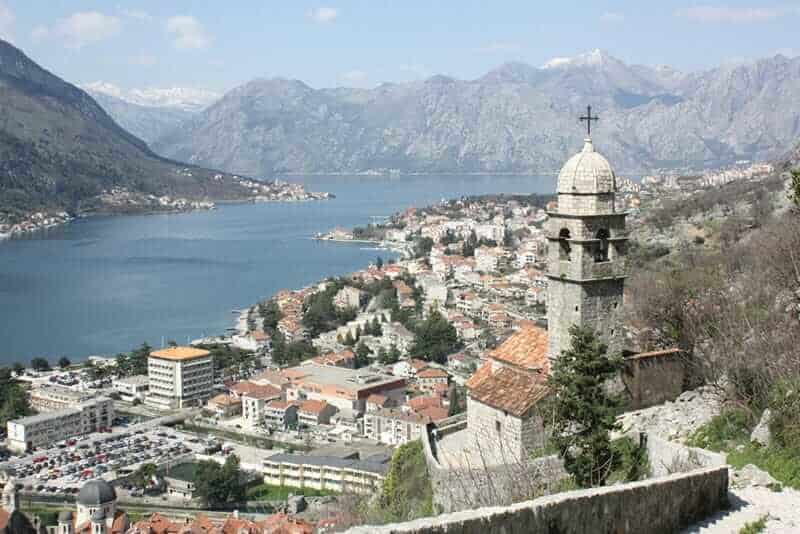 Photo taken from above of city of Kotor, Montenegro and surrounding bay and mountains taken from old city walls