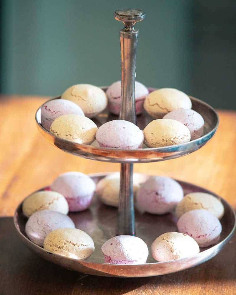 Double tiered serving tray of vegan baked goods