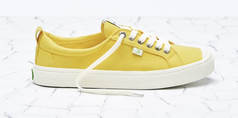 Yellow low top canvas sneakers with white sole and laces from Cariuma