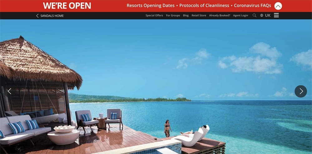 Screenshot of Sandals booking site showing lounger chairs overlooking the sea