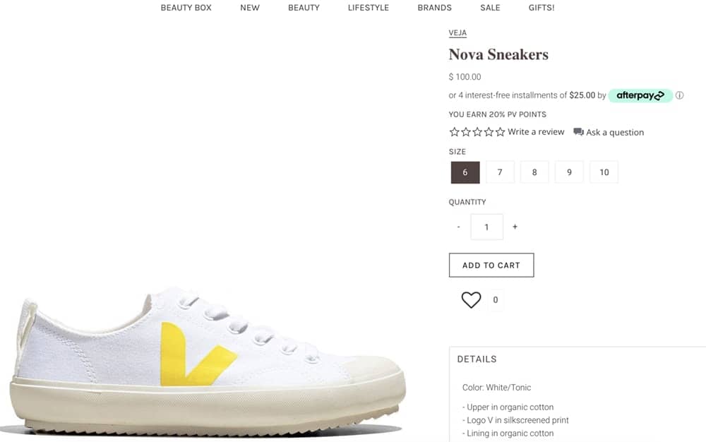 Screenshot from Veja site showing white Veja trainer with yellow V on side