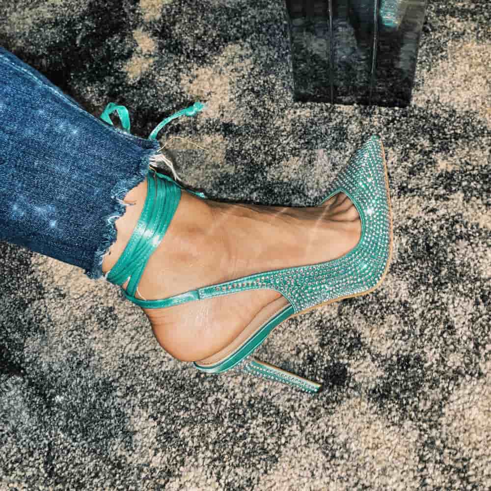 Sparkly teal stiletto shoes with ribbons tied around the ankle from Cult of Coquette