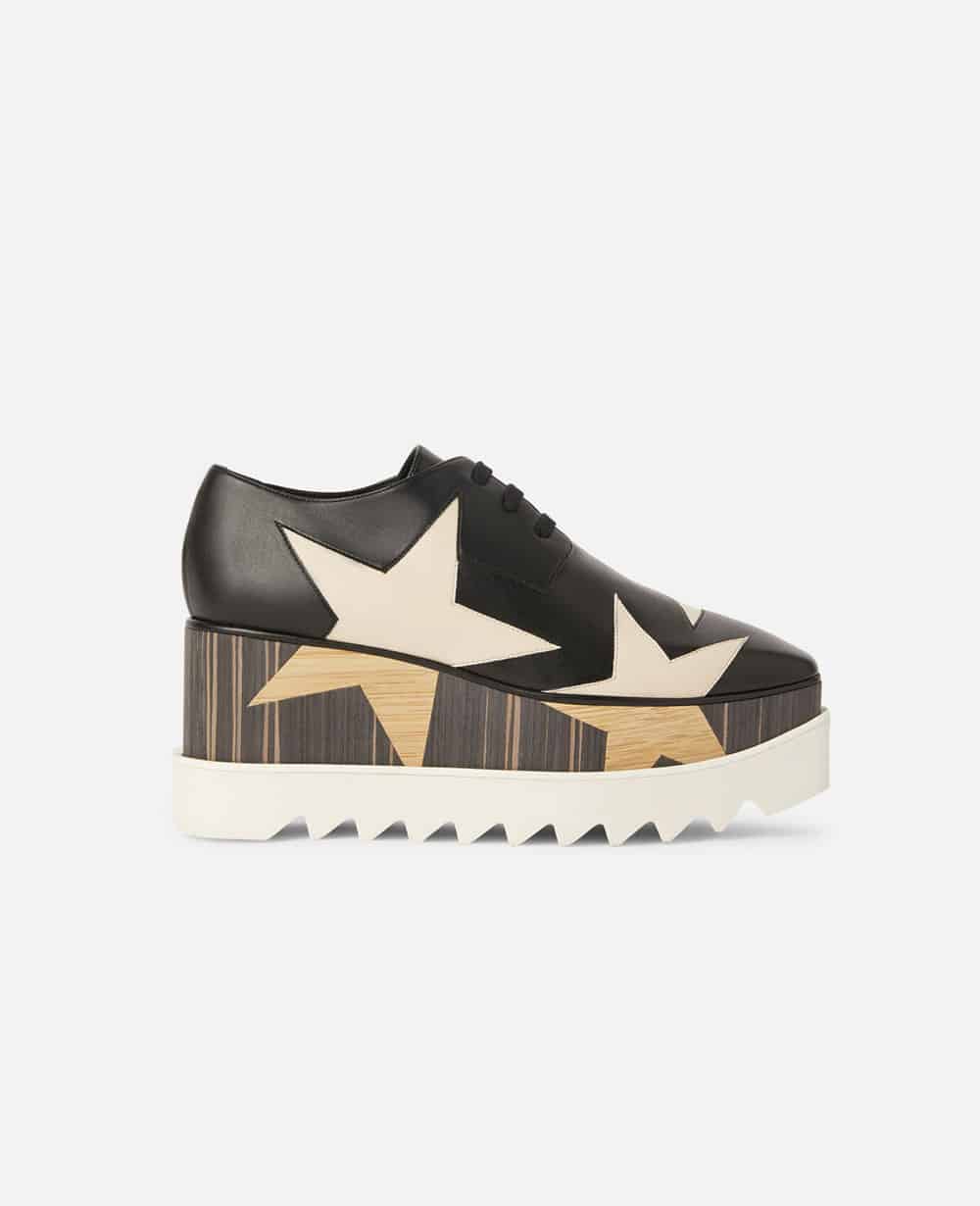 Platform black trainers with star pattern and white soles from Stella McCartney