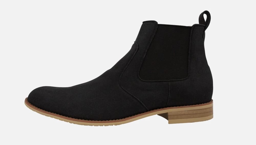 Low heel black boots with tan sole