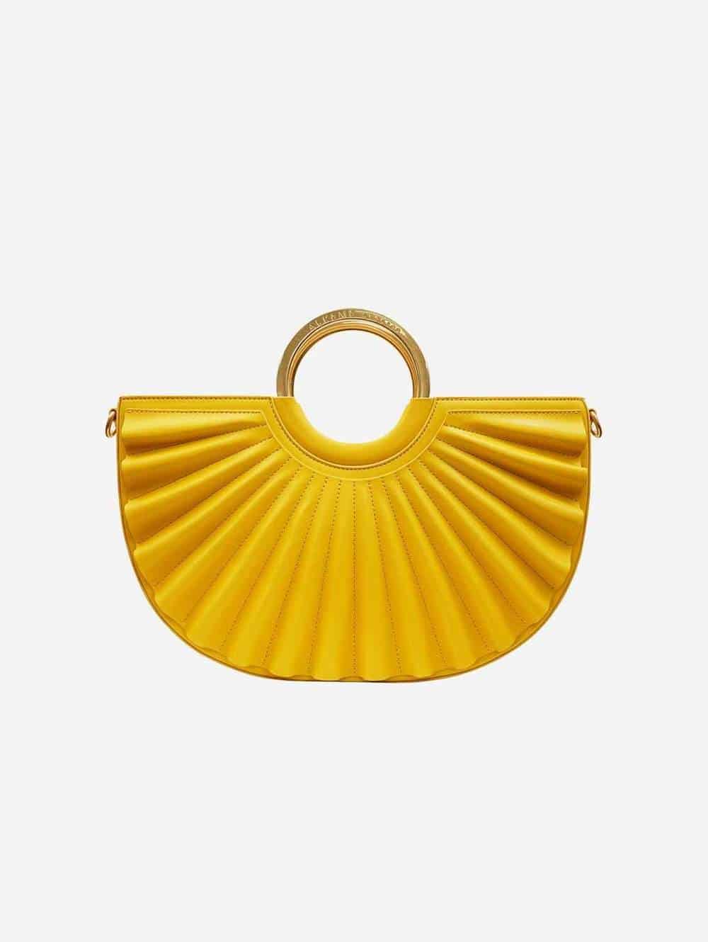 Yellow accordion bag with circular handle