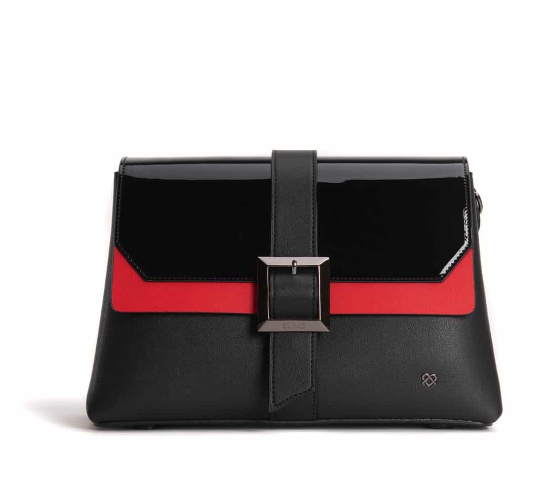 GUNAS crossbody bag in black and red with a buckle 