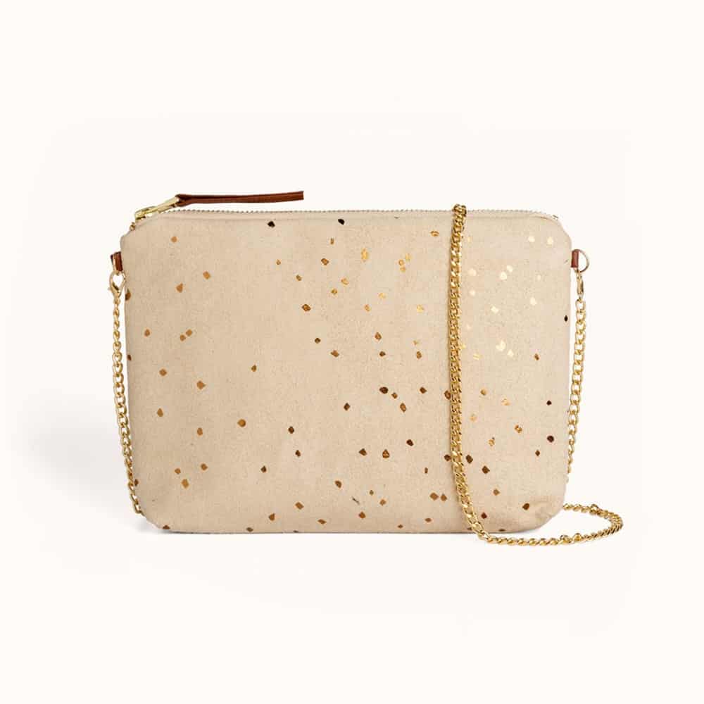Beige vegan leather bag with gold confetti print and gold toned metal chain link strap from vegan leather bags brands Lee Coren