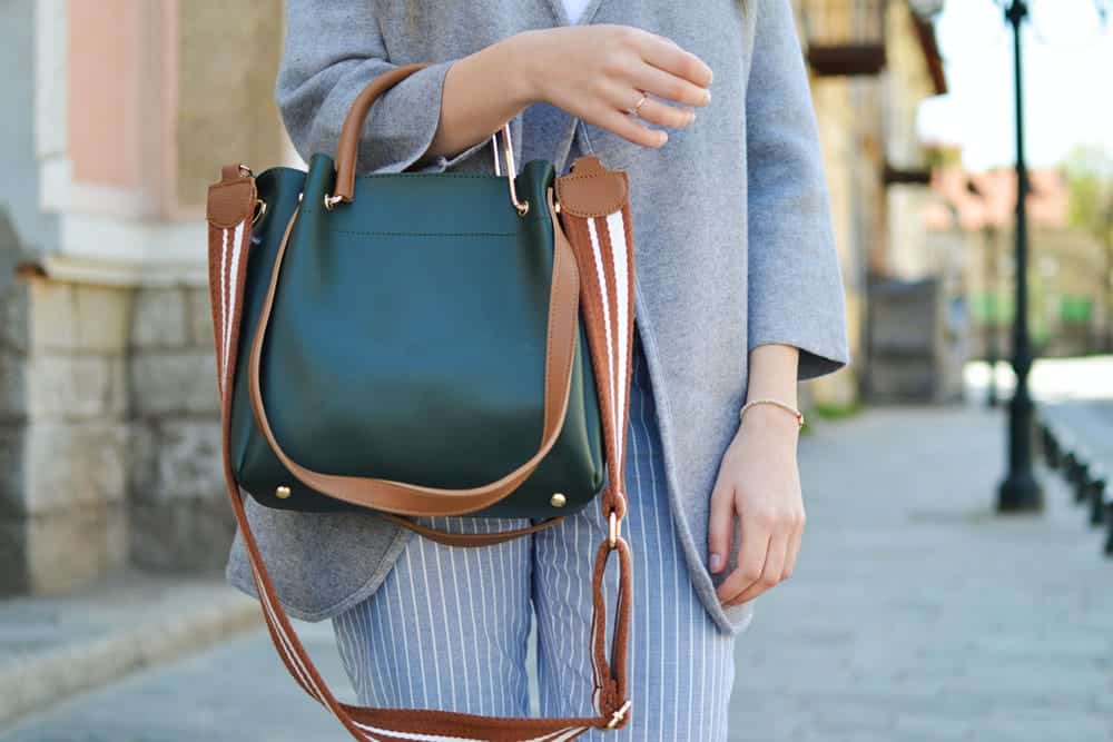 Brown and black tote bag with 3 handles of different lengths