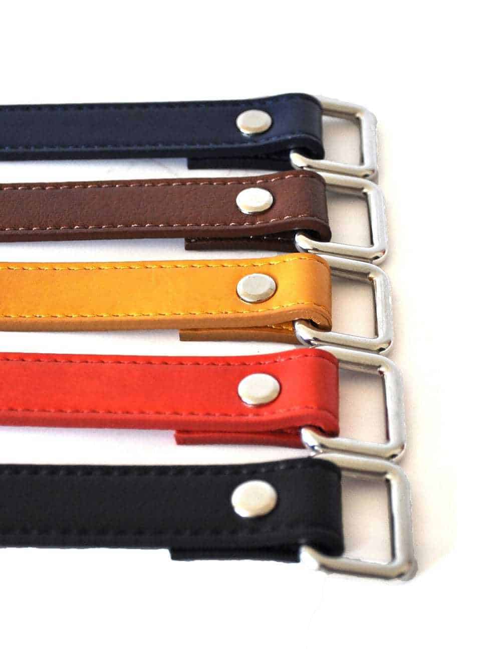 Blue, brown, yellow, red and black vegan leather belts with silver buckles from Noah