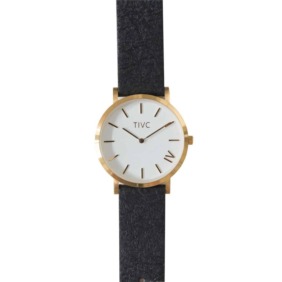 Minimalist watch with white dial, gold hardware, black strap