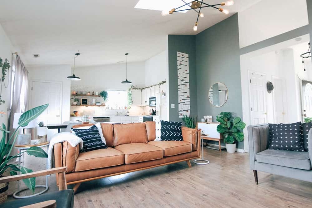 Shot of a living room showing two sofas, a brown one and grey-blue one