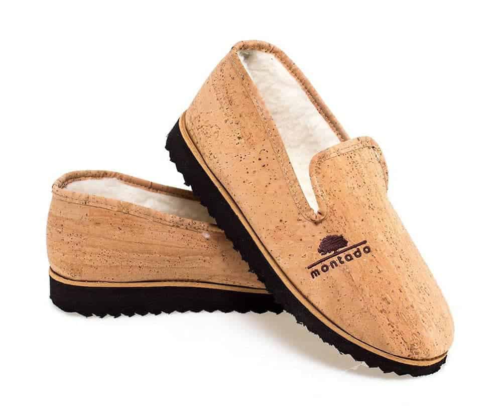Cork slippers with white lining and black soles (cork outer is natural cork colour). Stamp on outer shoe that says Montado and features a small graphic of a tree