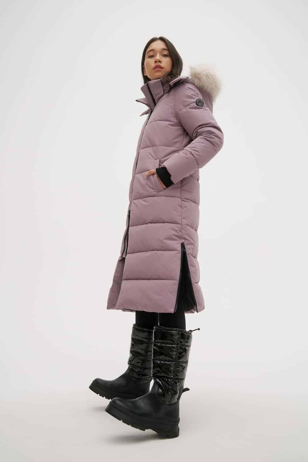 Person wearing long coat and vegan tall puffer boots