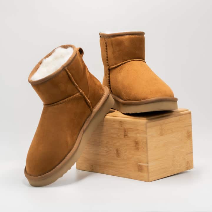 Brown vegan suede boots with white vegan fur lining
