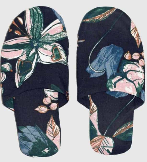 Navy blue slippers with large floral pattern in pink, green and lighter blue (closed toe mules)