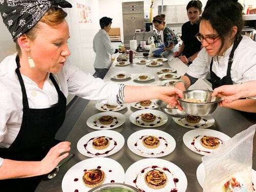 Chefs plating up dishes, Vegan Chef School