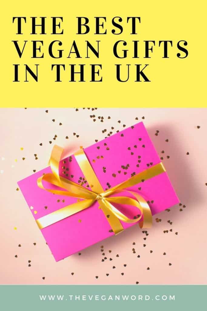 Pinterest image showing gift wrapped in bright pink wrapping paper and tied with yellow ribbon with text "the best vegan gifts in the UK"