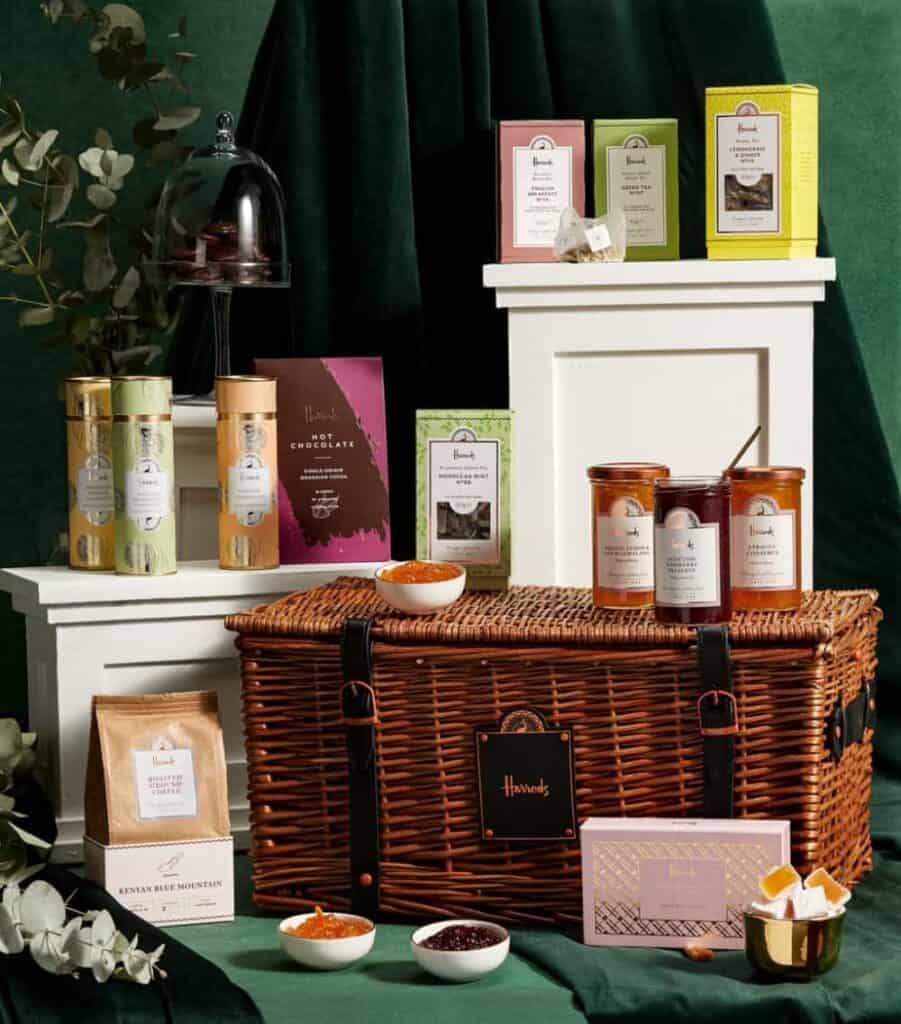 Harrods wicker hamper with preserves, teas, coffee and more around and on top