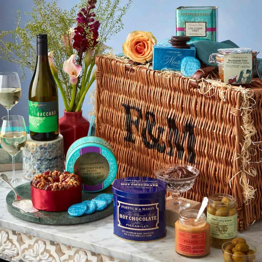 Fortnum & Mason hamper surrounded vegan vegan snacks and wine