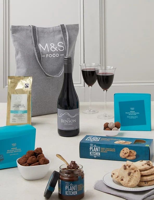 M&S grey tote bag in background, with wine, truffles and more in foreground
