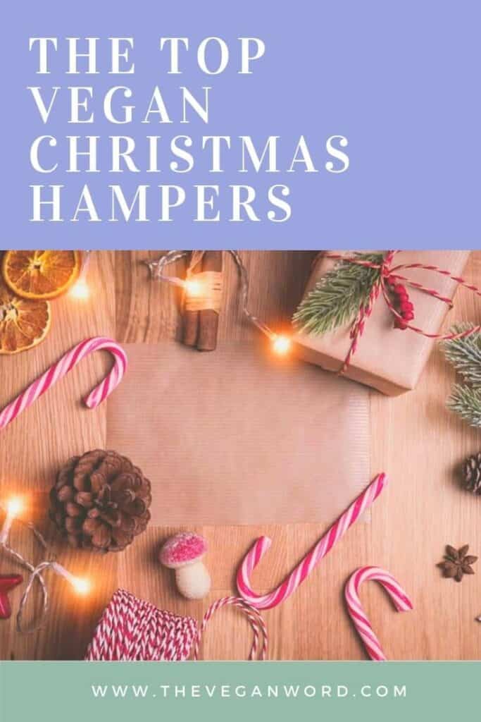 Pinterest image showing candy canes, pine cones, fairy lights and wrapped Christmas gift with text "the top vegan Christmas hampers"