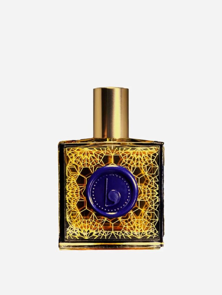 Lovorika vegan perfumes, bottle is gold and purple with intricate filigree design