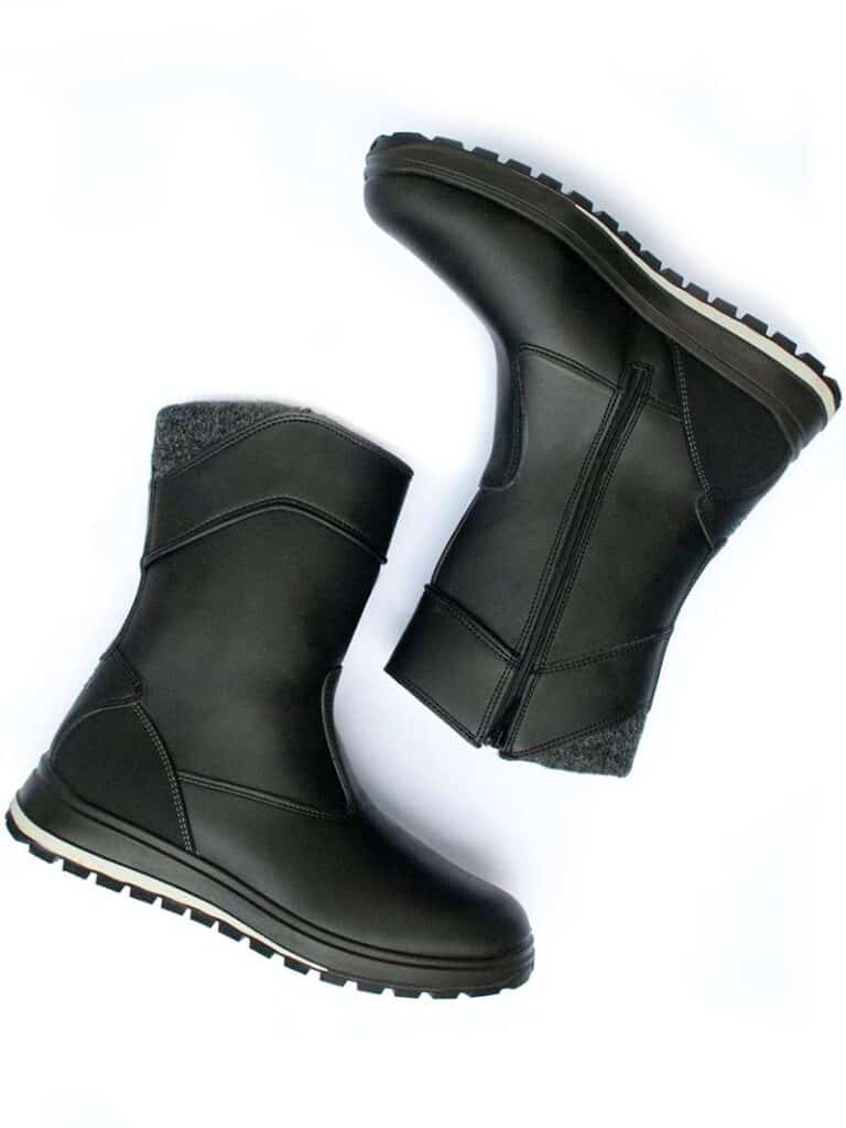 Insulated black vegan leather boots with tread soles