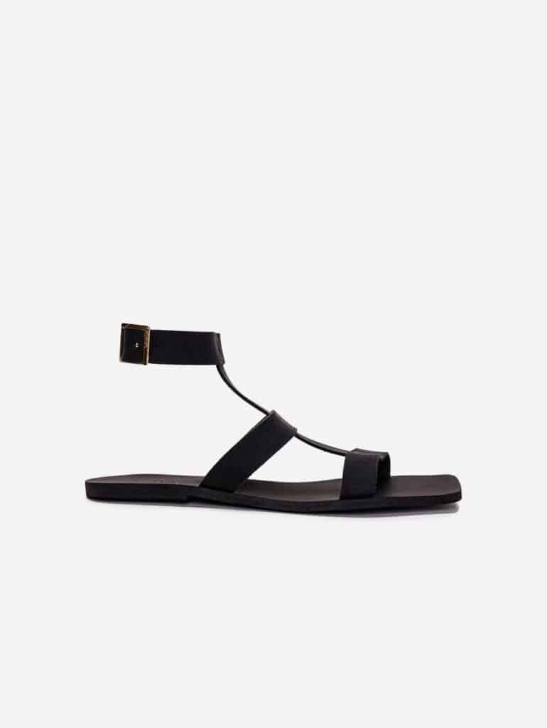 Vegan black leather strappy sandals with flat sole and high ankle strap