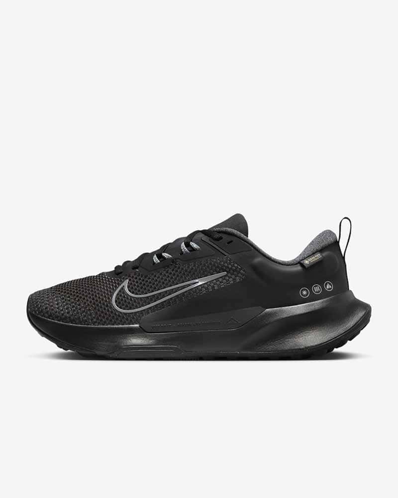 Nike leather free trail running shoes for men in black with white outline Nike logo, black laces and black soles
