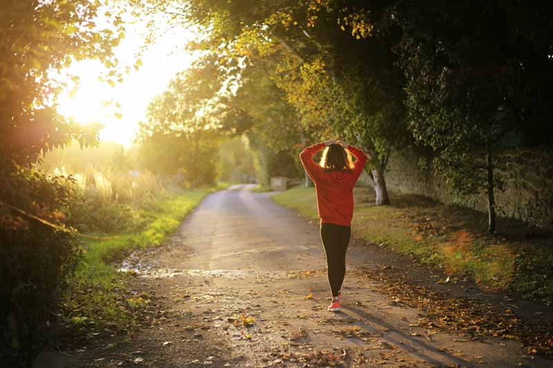 Runner on woodland path