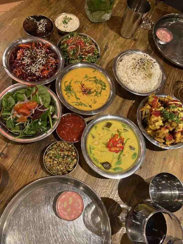 A spread of different vegan dishes from the set tasting menu, Amrutha Lounge, London
