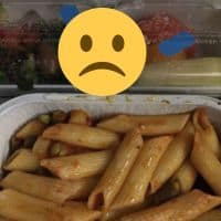 Sad-looking example of vegan airline meal (plain pasta, fruit)