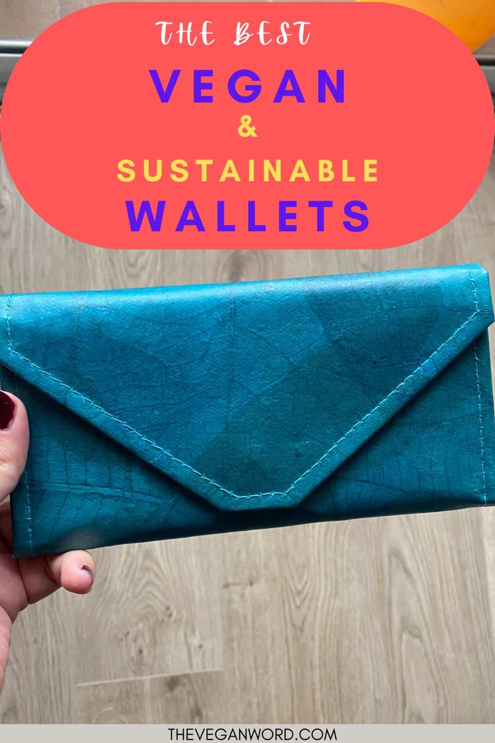 Pinterest image of a vegan leaf wallet (held by the author's hands) with text that reads "the best vegan  & sustainable wallets"